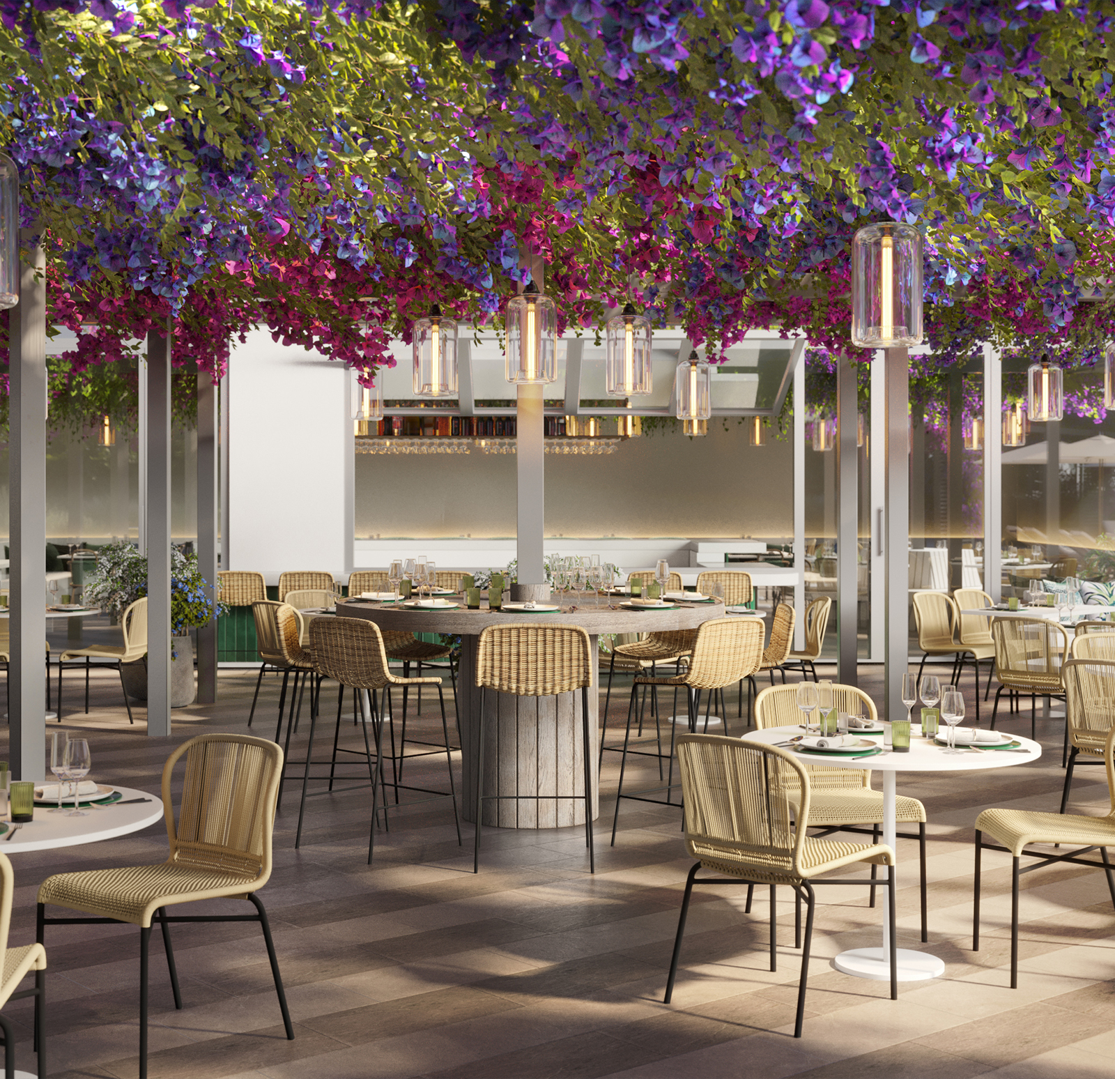 Five Park outdoor dining terrace with woven chairs and tables beneath a dense canopy of pink and purple flowers and hanging glass lights.