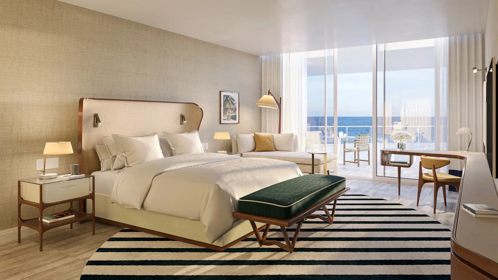 Four Seasons Fort Lauderdale guest room with white bedding, a green bench, striped rug, and floor-to-ceiling doors overlooking the ocean.
